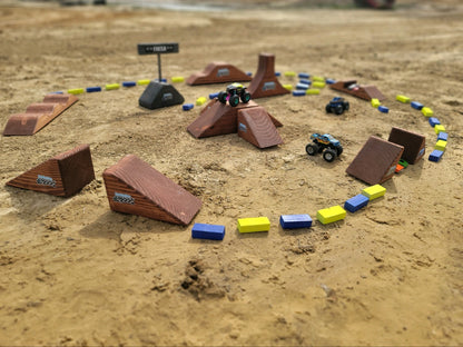 toy wooden track with big monster track and monster trucks jumping